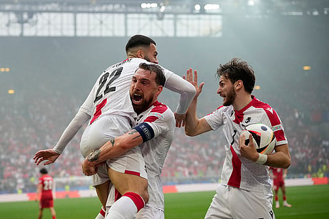 Georges Mikautadze celebrates after scoring Georgia's opening goal 